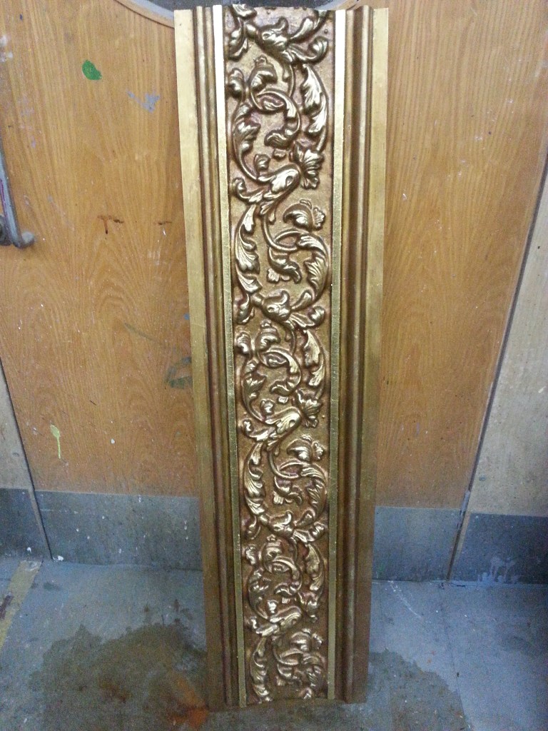 Verdigris gold effect on plastic with gold leafing and paint